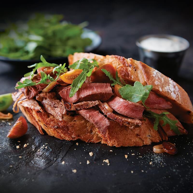 Black and Blue Ribeye with Blue Cheese, Applewood Bacon and Roasted Peppers