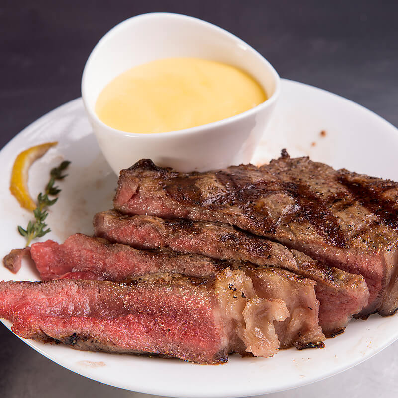 Bone-In Kansas City Strip Steak with Hollandaise Sauce