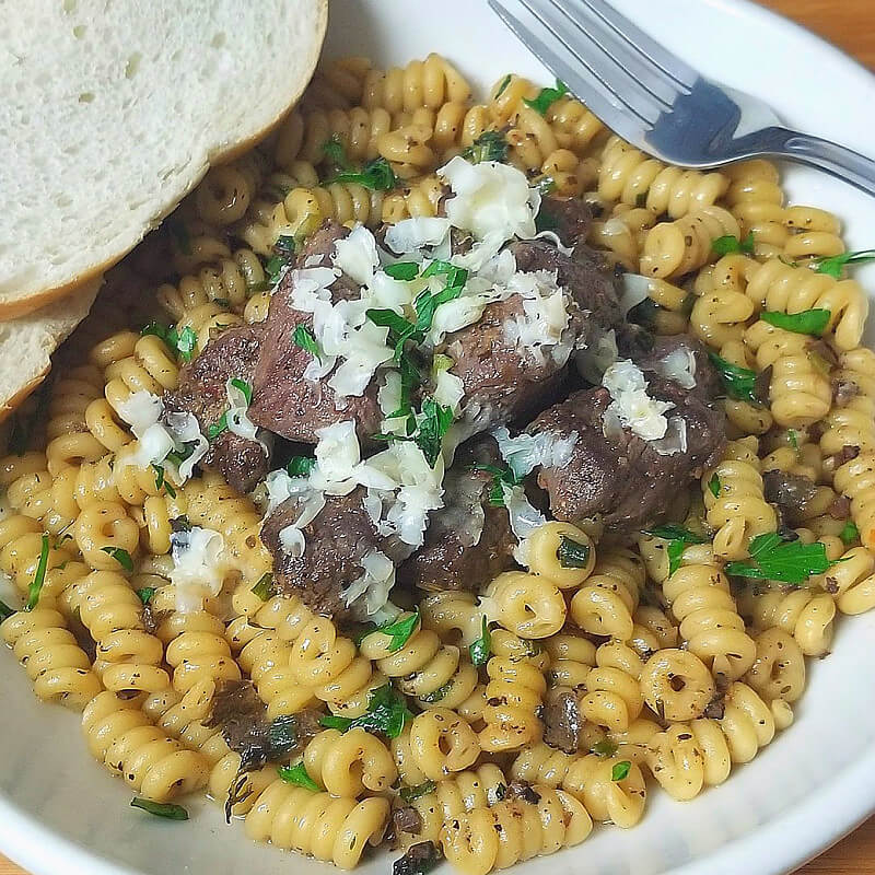 Beef Filet Tips over Black Truffle Butter Pasta